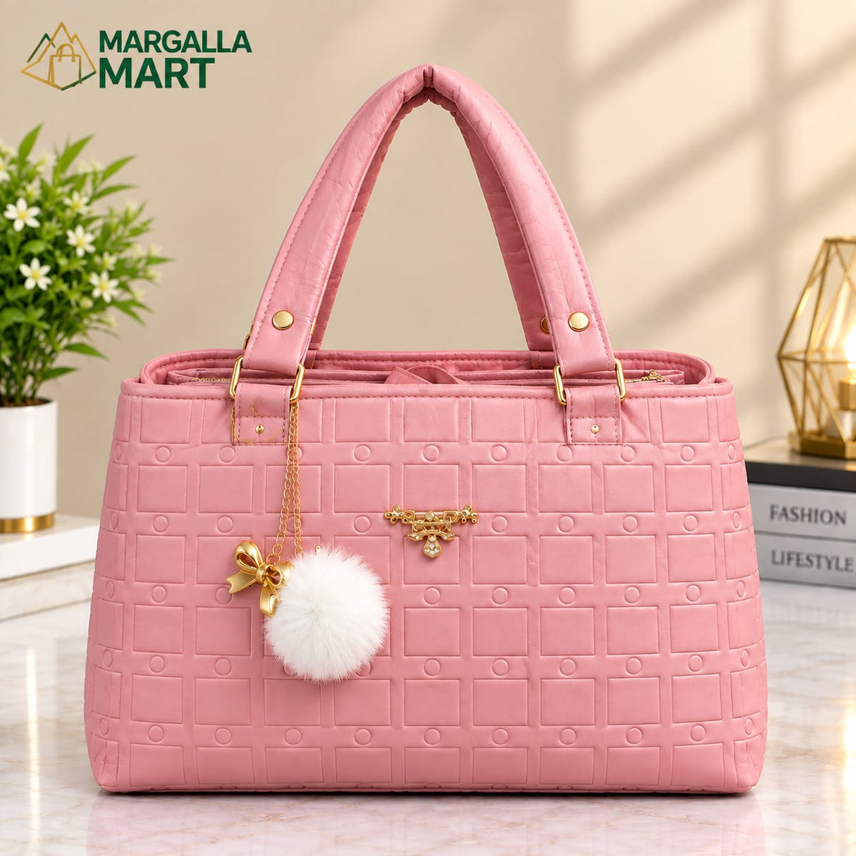 Elegant Pink Women’s Handbag with Gold Accents & Pom-Pom Charm